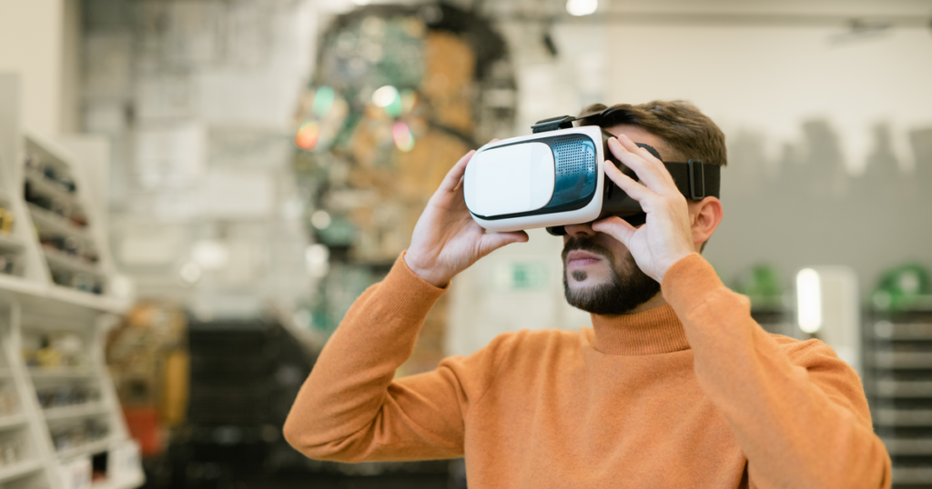 Man using VR headset in a retail store, highlighting tech innovation in application-centric PaaS for retail environments.