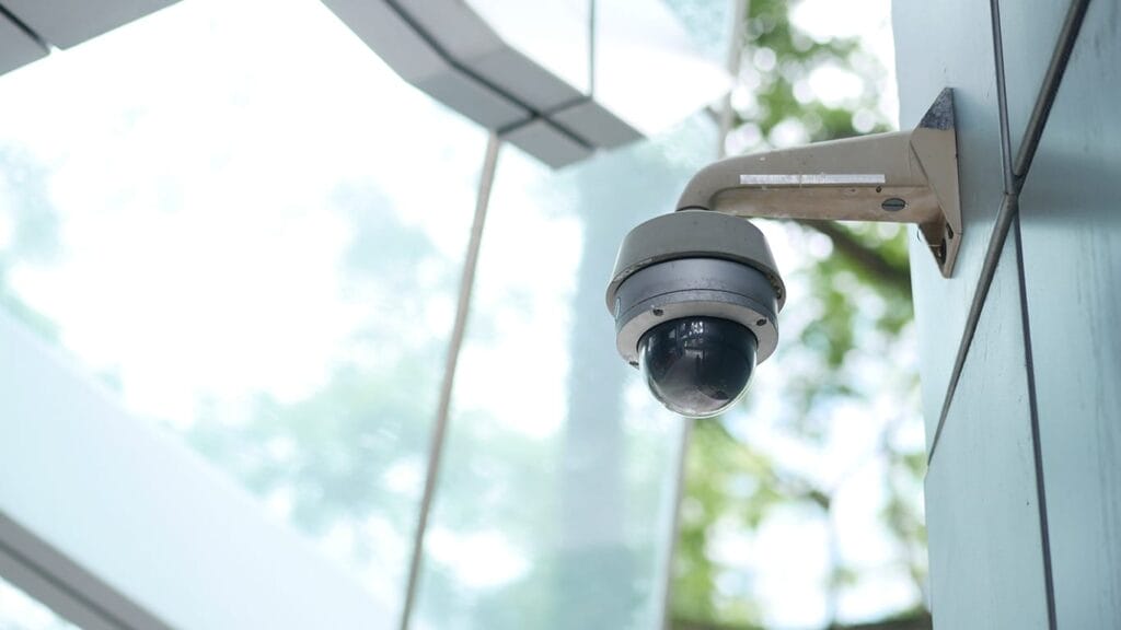 Security camera, representing edge AI for monitoring and security in distributed environments.