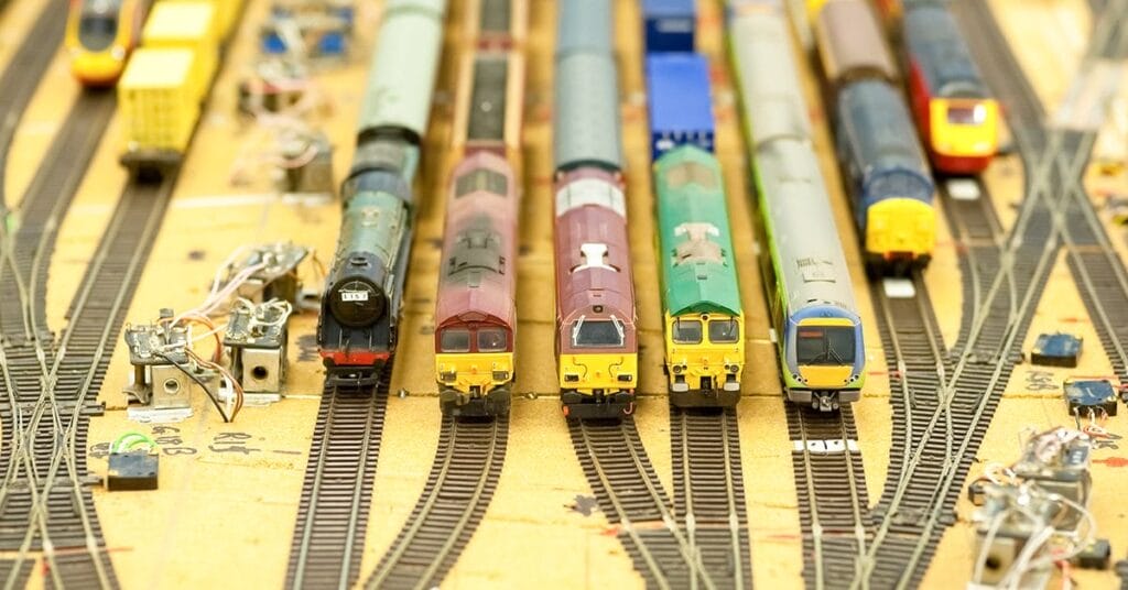 model trains standing on train station