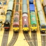 model trains standing on train station