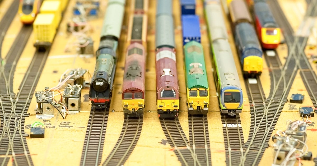 model trains standing on train station