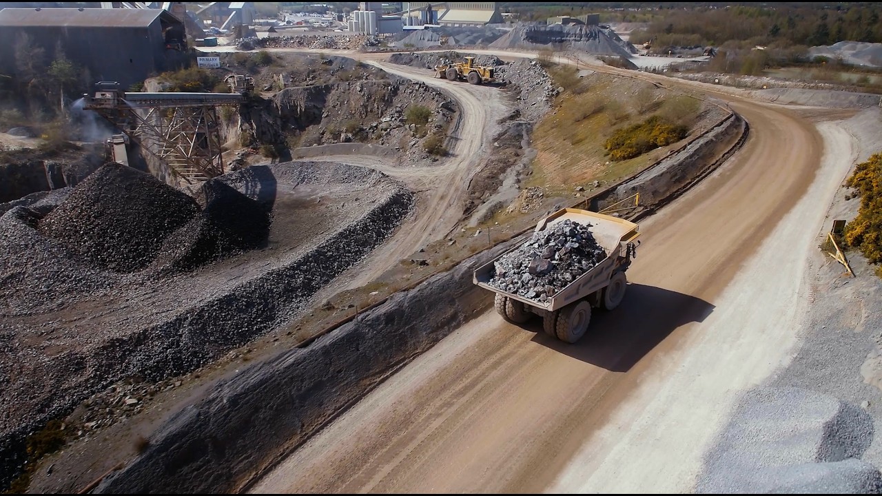 Aerial view of a haul truck at an industrial quarry site from the Avassa edge computing mini documentary